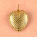 An early to mid 19th century 18ct gold star motif heart locket.
