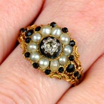 A Georgian 18ct gold black garnet, split pearl and old-cut diamond mourning ring,