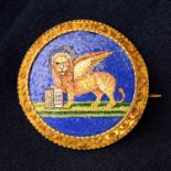 A mid 19th century micro mosaic brooch, depicting a Venetian Lion, with gold cannetille surround,