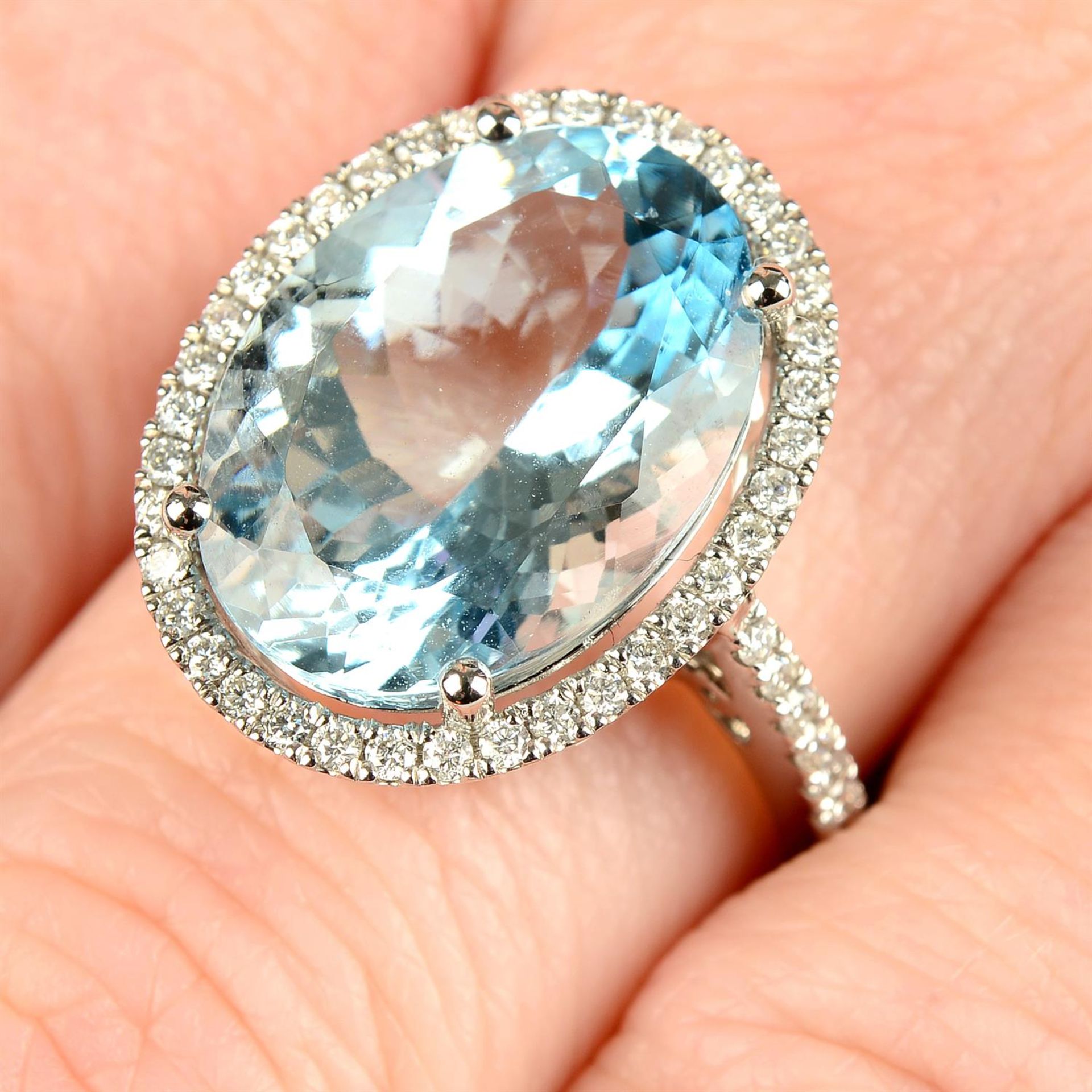 An 18ct gold aquamarine and brilliant-cut diamond dress ring.