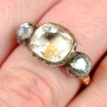 A 17th to 18th century silver and gold foil back rock crystal three-stone ring, with traces of