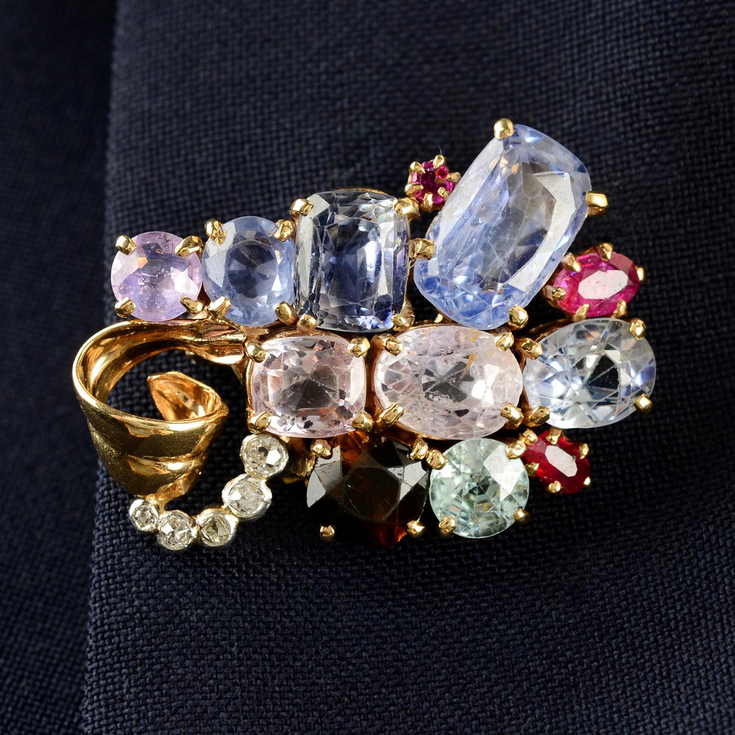 An early to mid 20th century multi-gem suite, comprising brooch, ring and earrings,