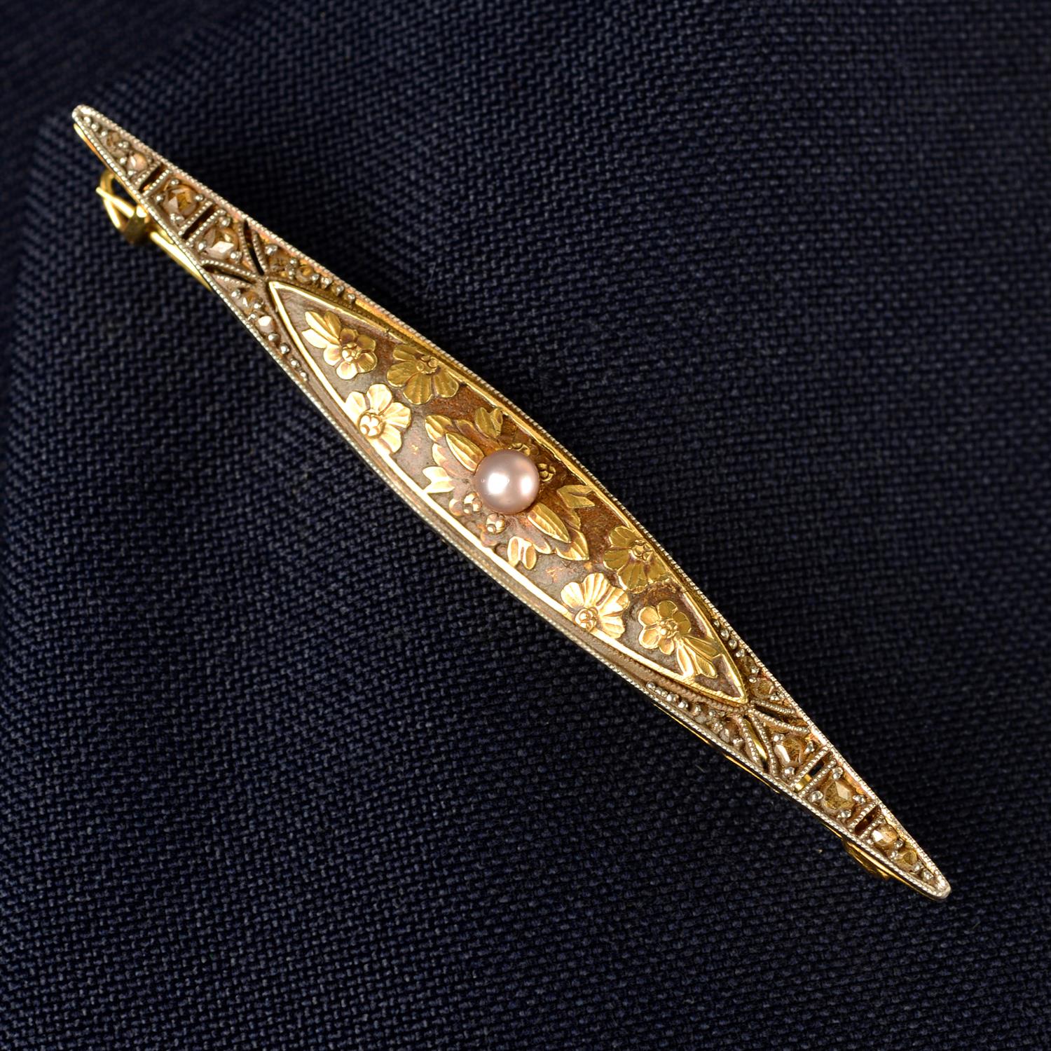An early 20th century gold and platinum rose-cut diamond and seed pearl floral bar brooch.