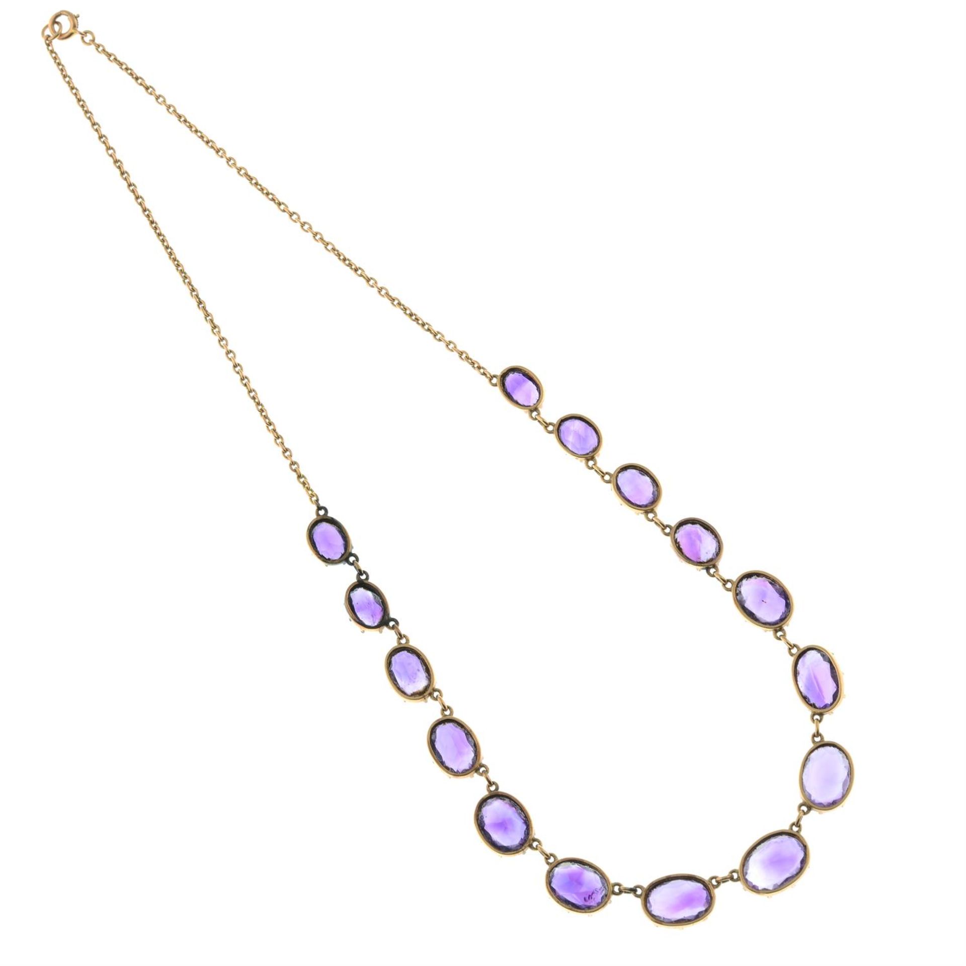 A 19th century gold graduated amethyst rivière necklace, with chain-link back-chain. - Image 4 of 4