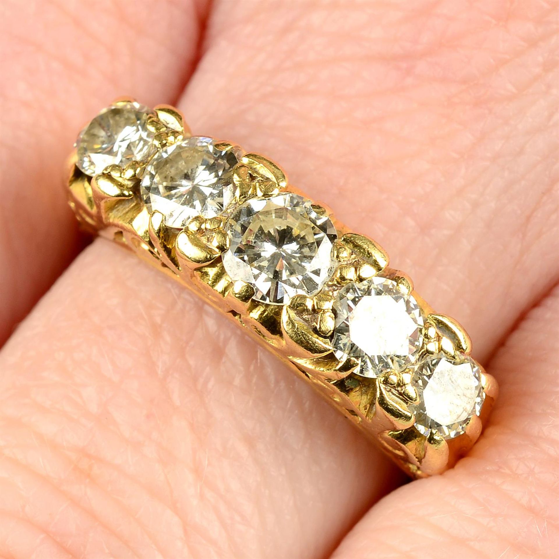 An early 20th century 18ct gold transitional-cut diamond five-stone ring.