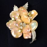 A baroque cultured pearl, 'yellow' diamond and diamond floral brooch, partially set 'en tremblant'.