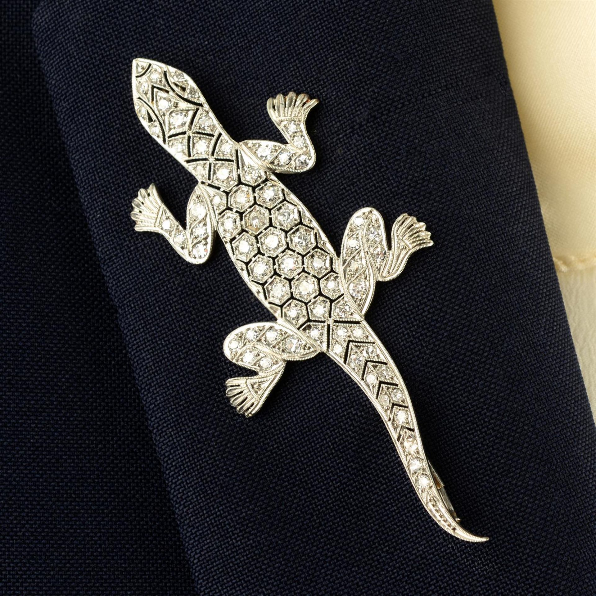 A single-cut diamond lizard brooch.