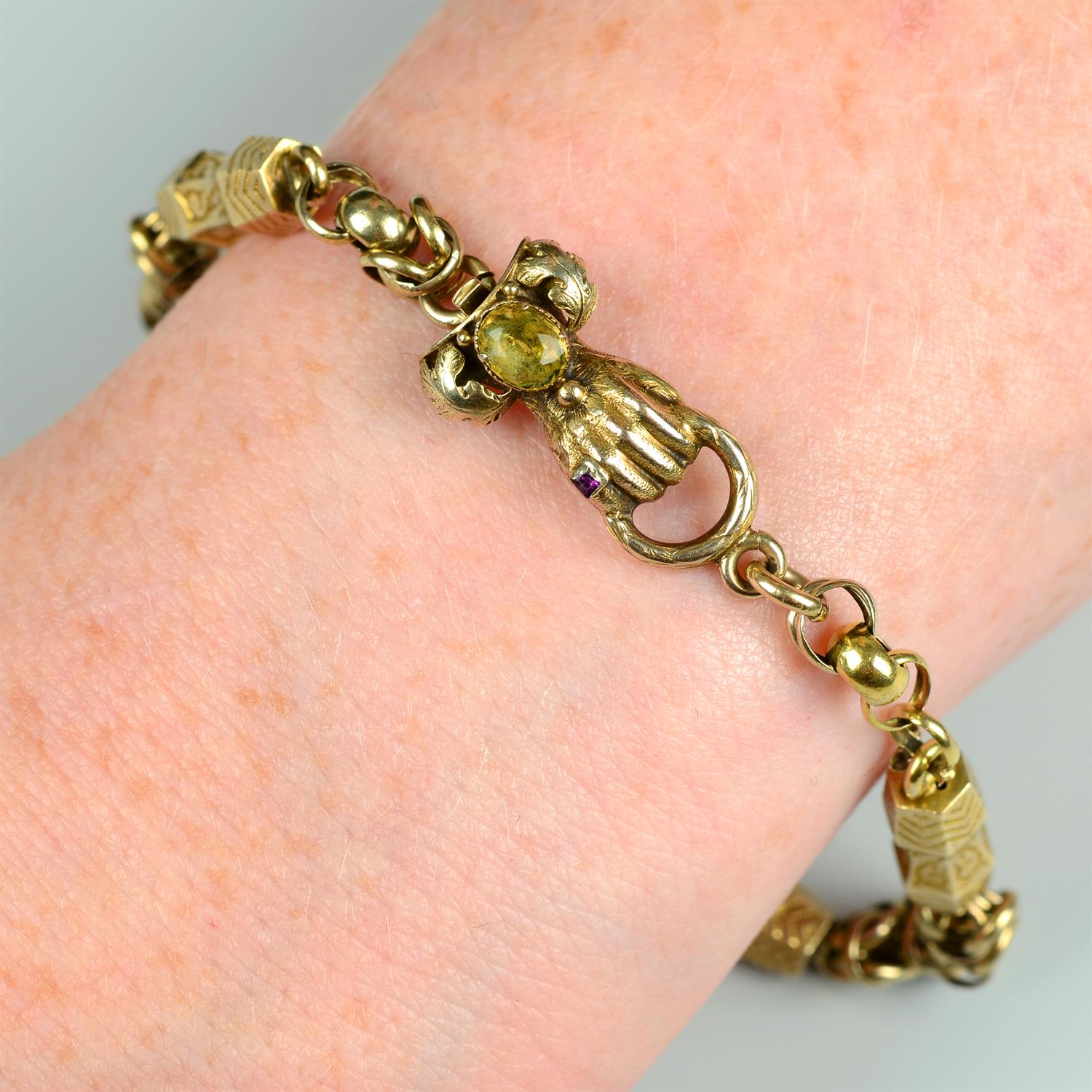 An early to mid 19th century gold, engraved spacer Kings-link bracelet, with ruby ring accent