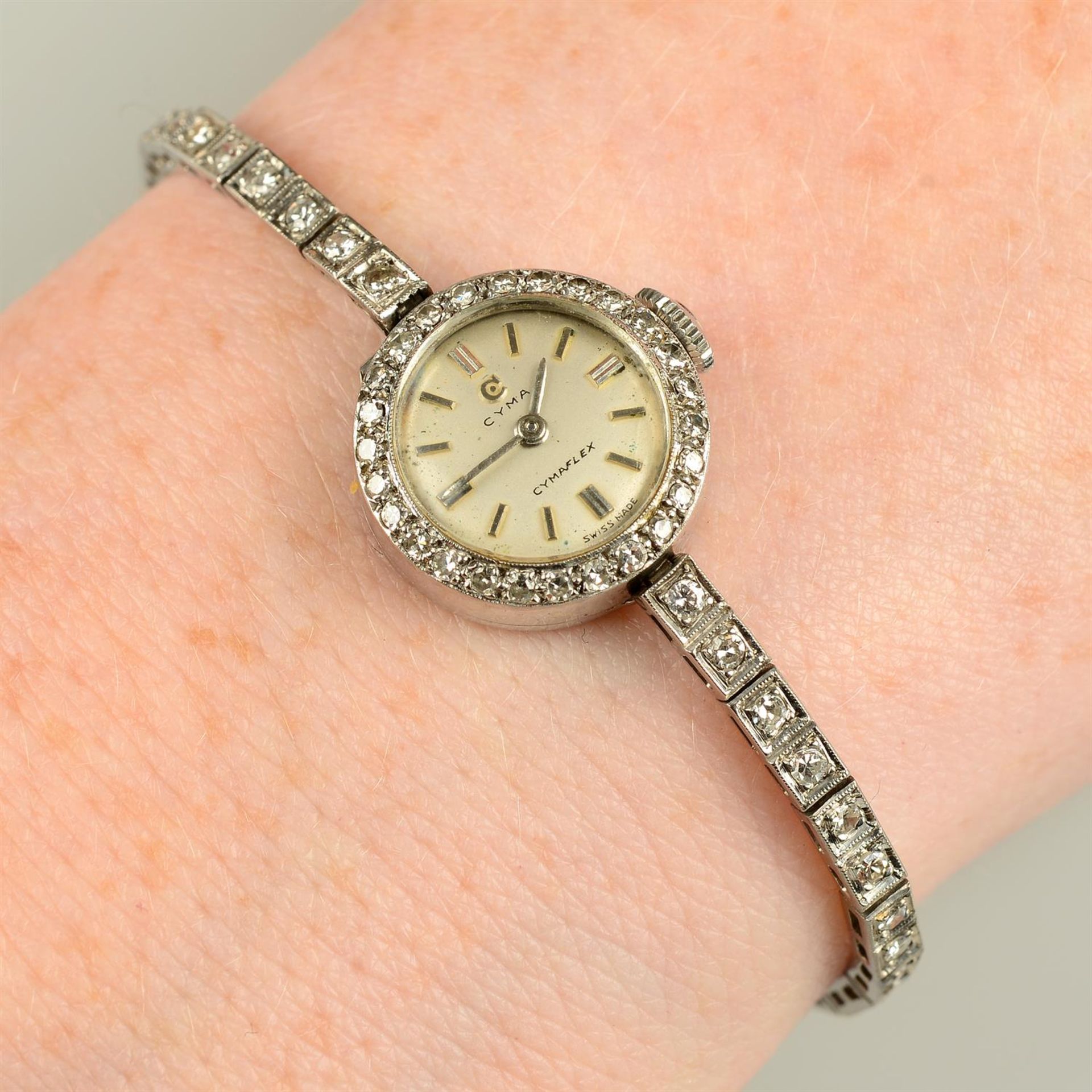 A 1950s 18ct gold single-cut diamond Cymaflex cocktail watch, by Cyma.