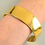 A 1970s 18ct gold flared bangle, by Georg Jensen, with later engraved bunny.