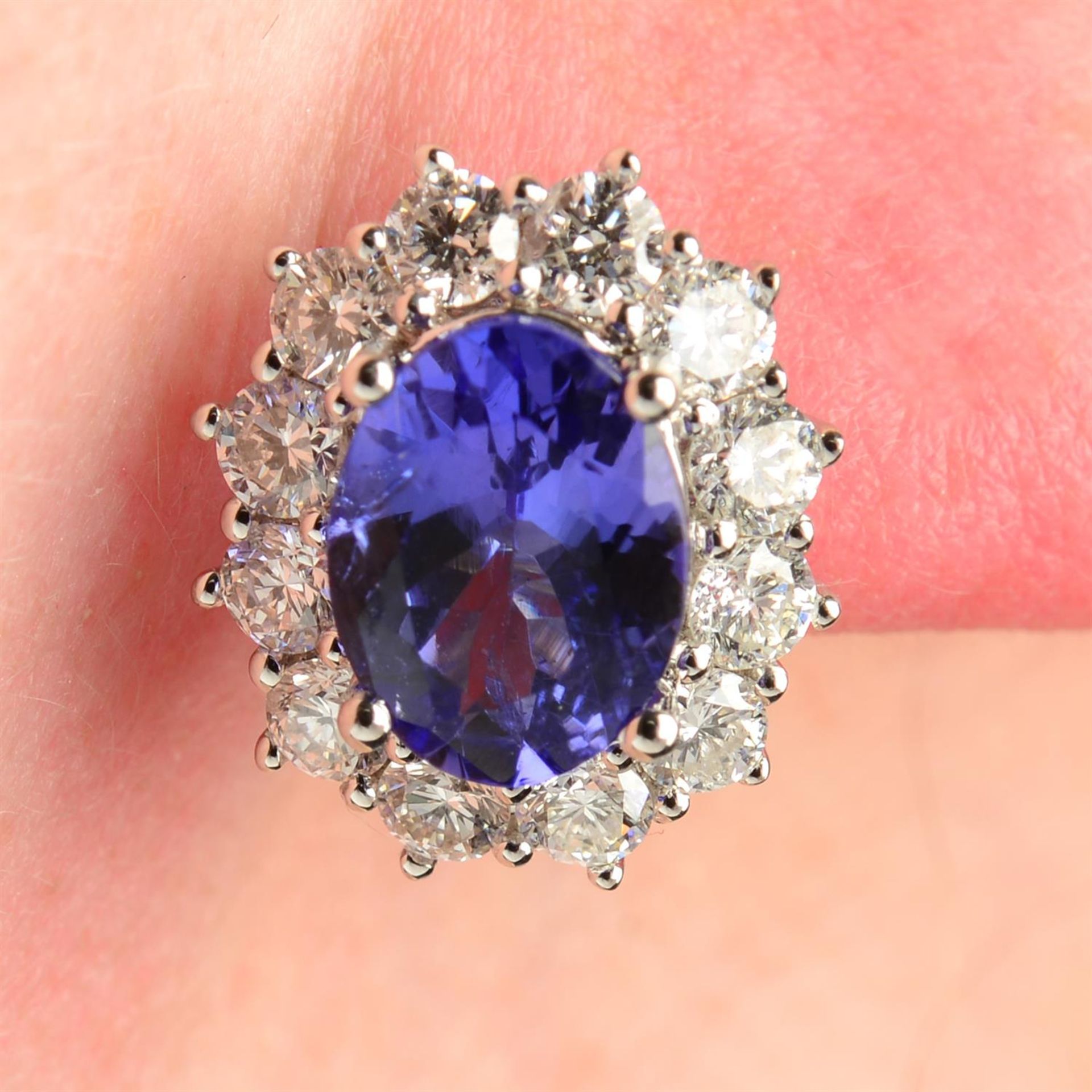 A pair of 18ct gold tanzanite and brilliant-cut diamond cluster earrings.