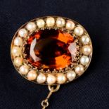 A late 19th century 14ct gold citrine and split pearl brooch.