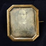 A mid 19th century daguerreotype photographic memorial brooch, with woven hair glazed locket and
