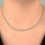 An 18ct gold graduated brilliant-cut diamond line necklace, with bead-link back-chain.