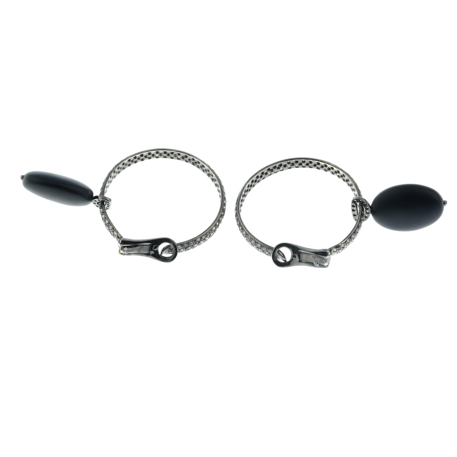 A pair of pavé-set diamond hoop earrings, with detachable black rubber and diamond drop. - Image 4 of 4