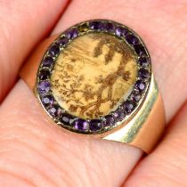 A 19th century 9ct gold scenic hairwork memorial ring, with purple garnet surround.