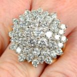 A brilliant-cut diamond cluster ring.