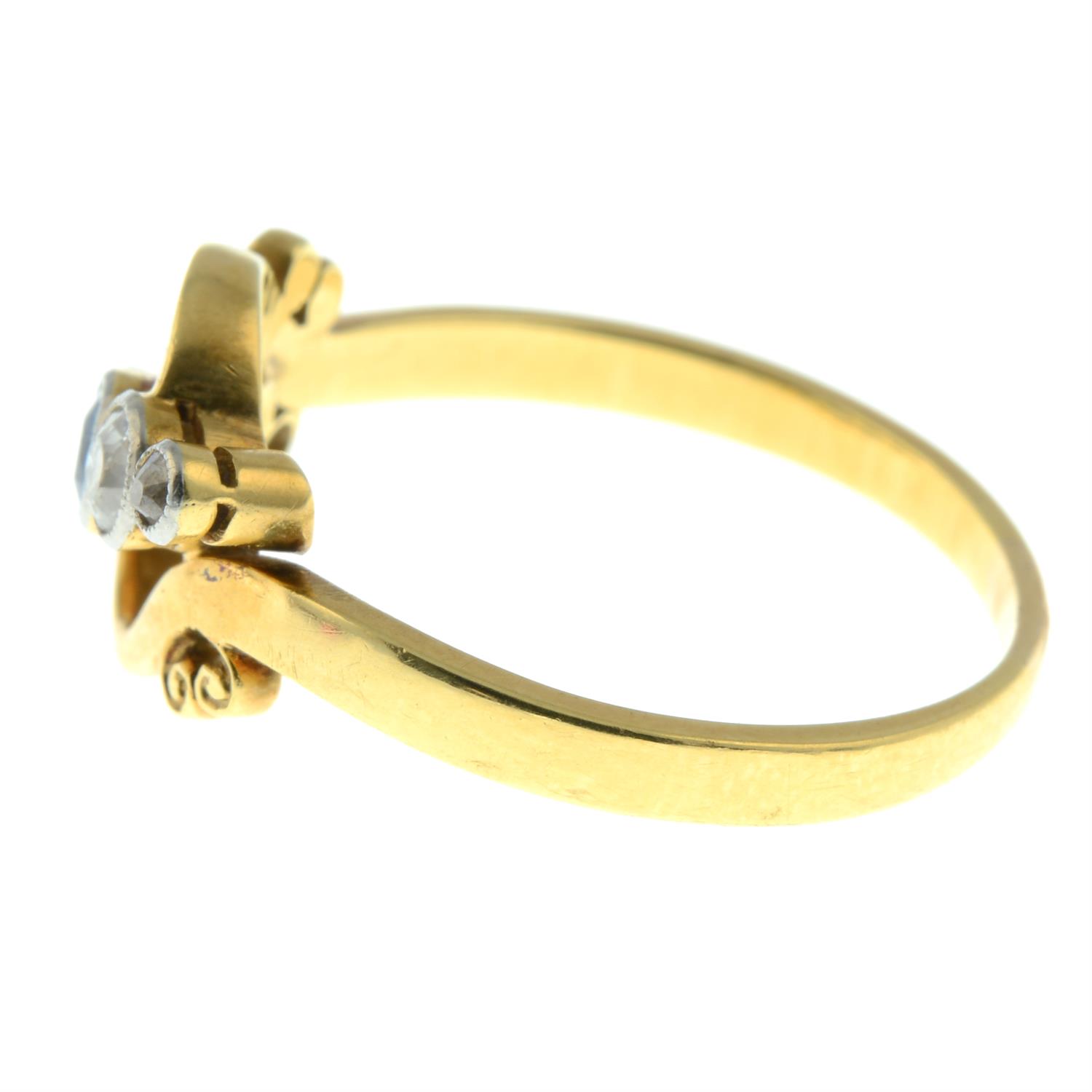 An early 20th century 18ct gold and platinum sapphire and old-cut diamond five-stone crossover ring. - Image 3 of 5