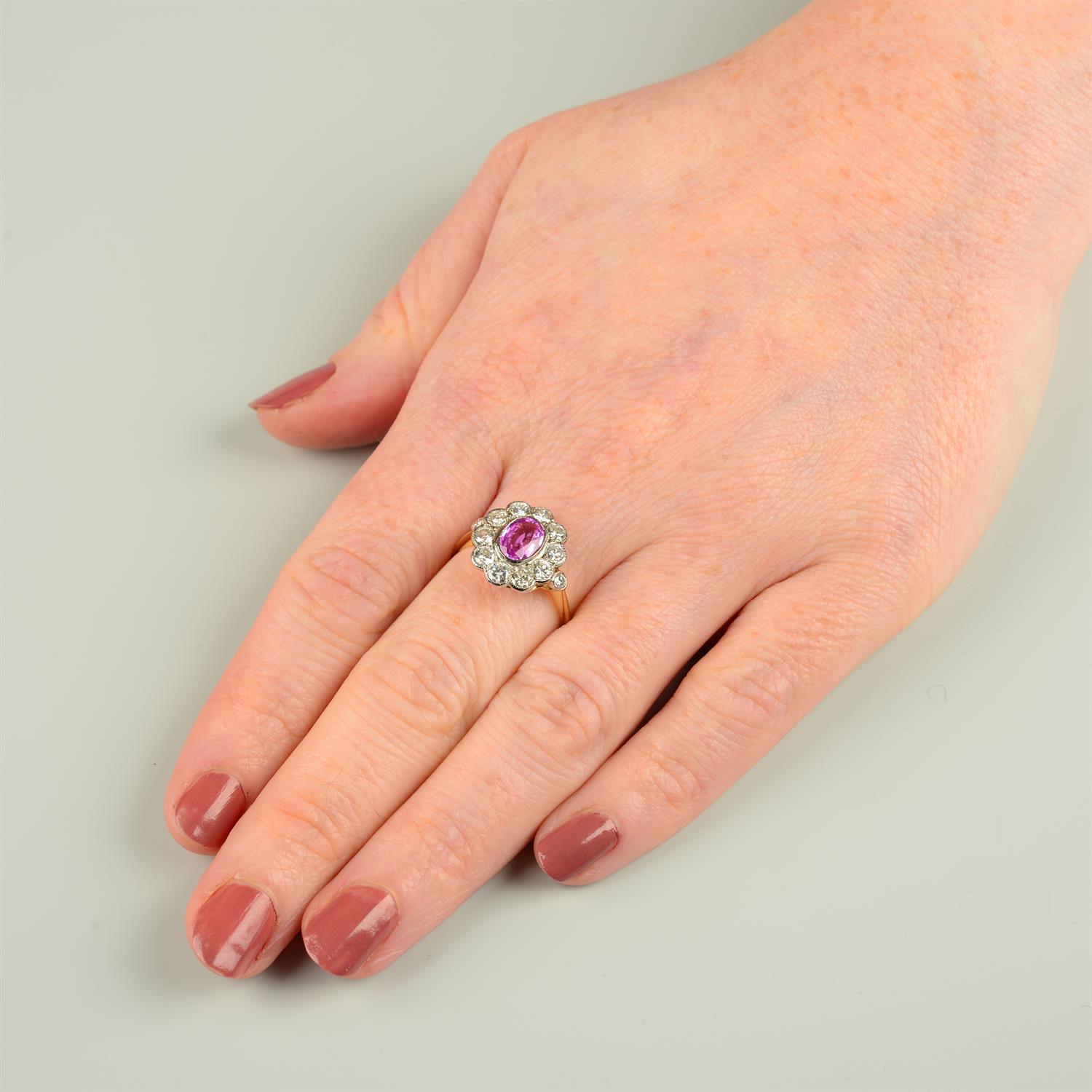 A pink sapphire and brilliant-cut diamond cluster ring. - Image 5 of 5