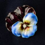 An early 20th century gold old-cut diamond and enamel pansy brooch.