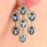 A pair of sapphire and diamond chandelier earrings.