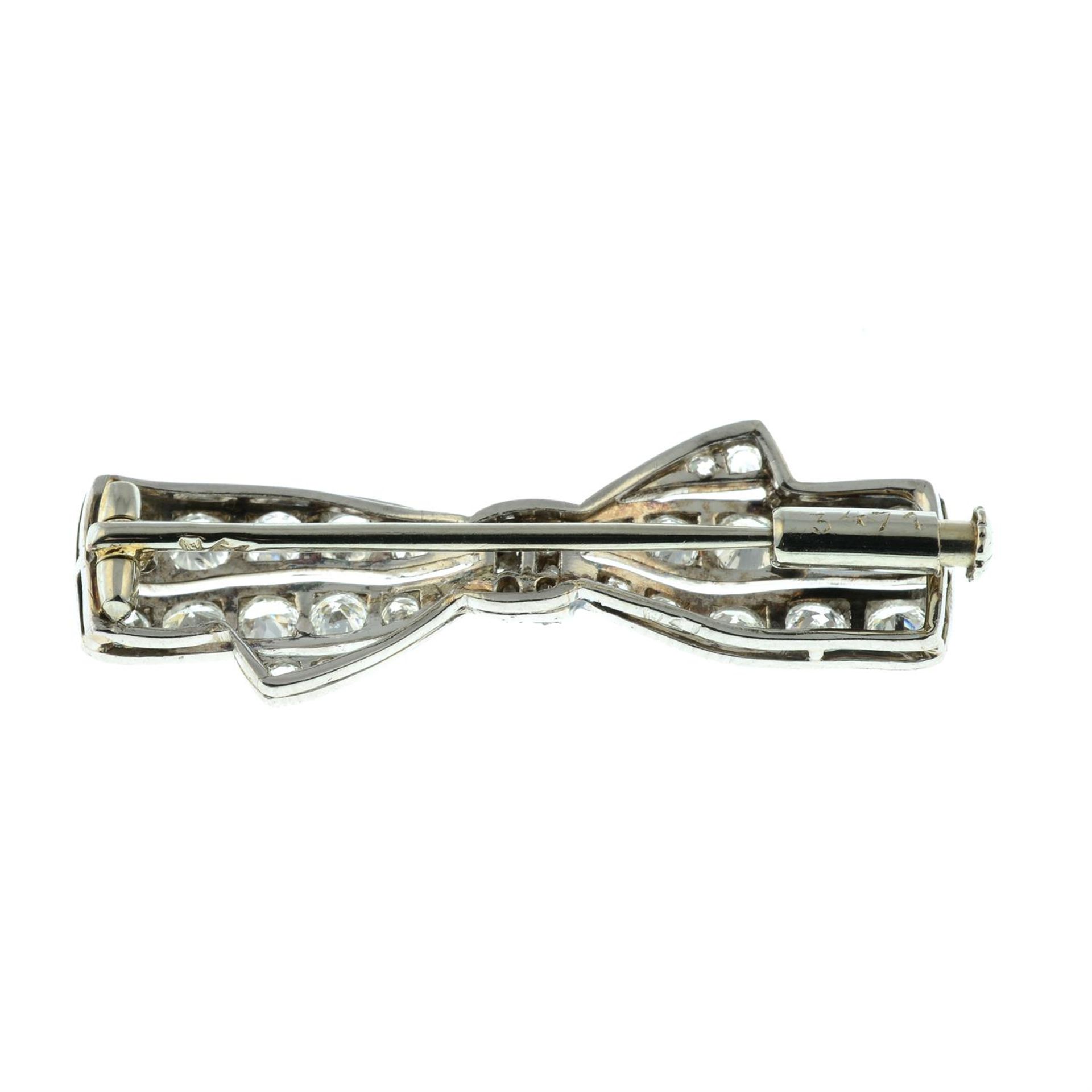 An early 20th century platinum and gold circular-cut diamond bow brooch. - Image 3 of 4