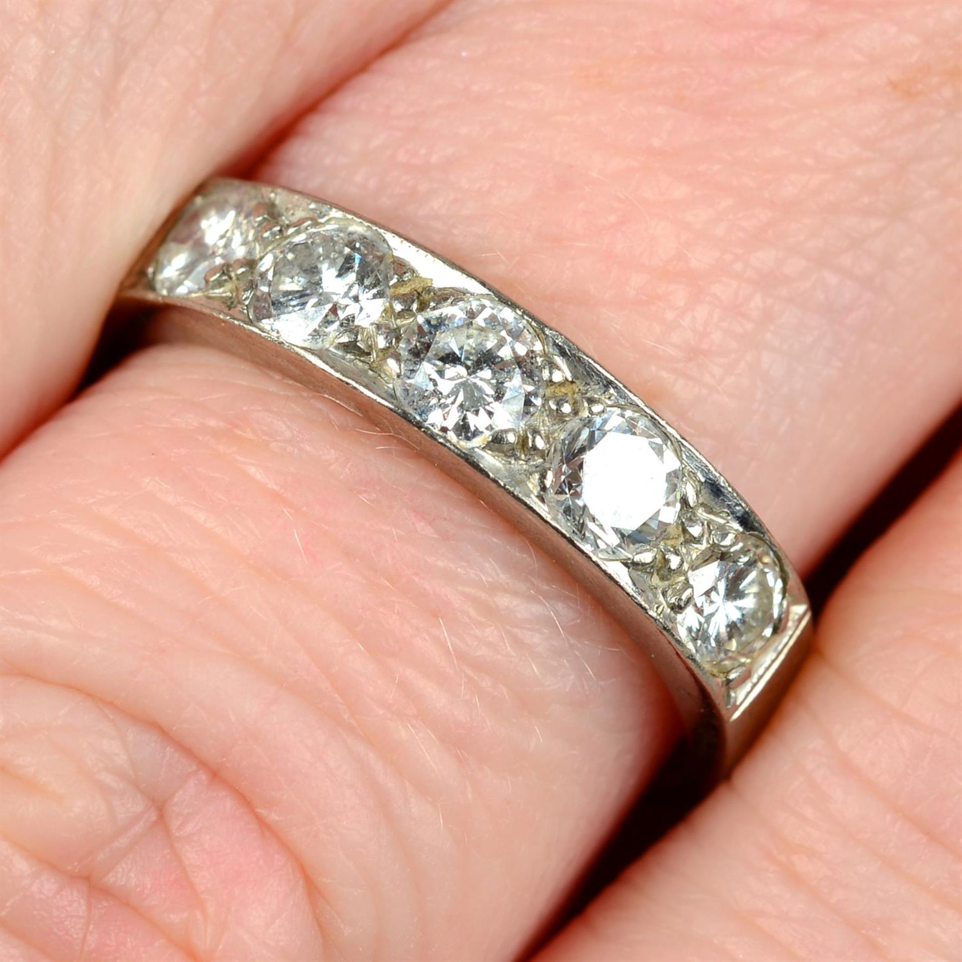A mid 20th century 18ct gold brilliant-cut diamond five-stone band ring.