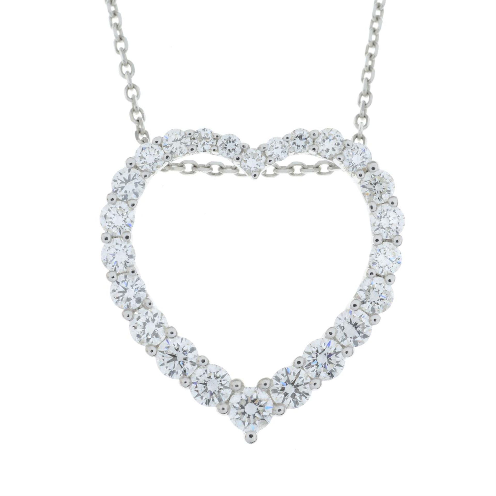 A graduated brilliant-cut diamond heart-shape pendant, with trace-link chain. - Image 2 of 5