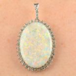 An opal and diamond cluster pendant.