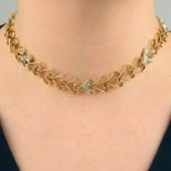 An open heart-link necklace, with pavé-set diamond link highlights.