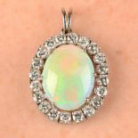 An opal and brilliant-cut diamond cluster pendant.