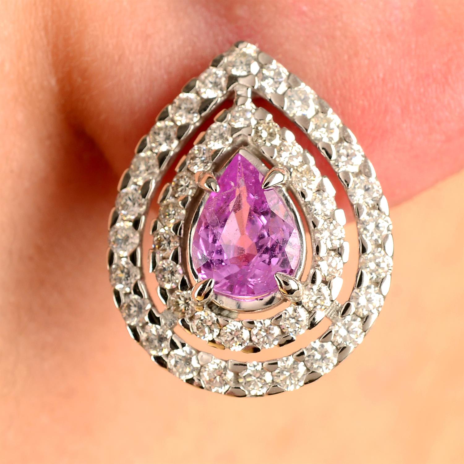 A pair of pink sapphire and brilliant-cut diamond cluster earrings.