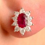 A pair of 18ct gold ruby and brilliant-cut diamond cluster earrings.