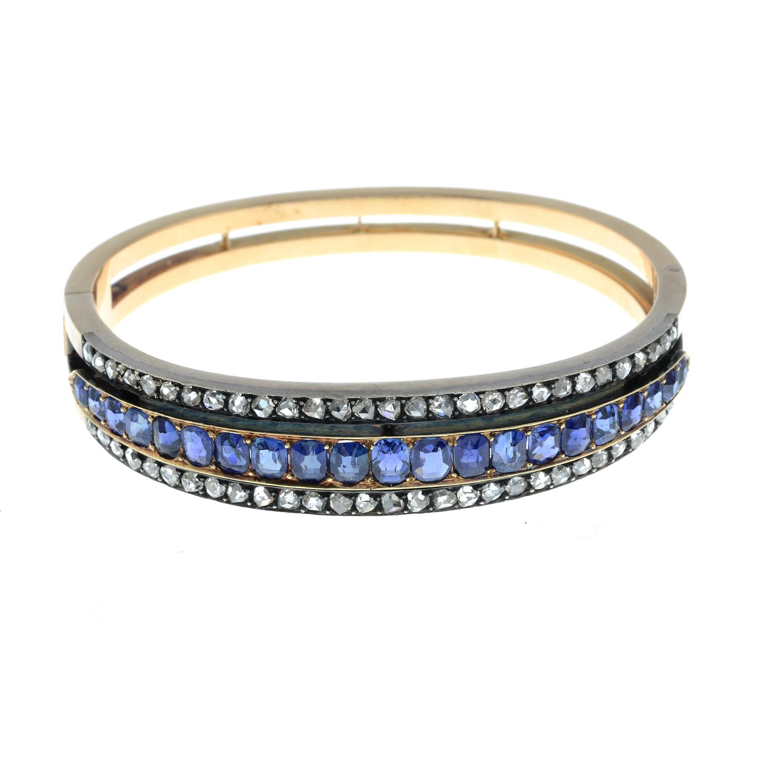 A late 19th century silver and 18ct gold sapphire and rose-cut diamond hinged bangle. - Image 2 of 3