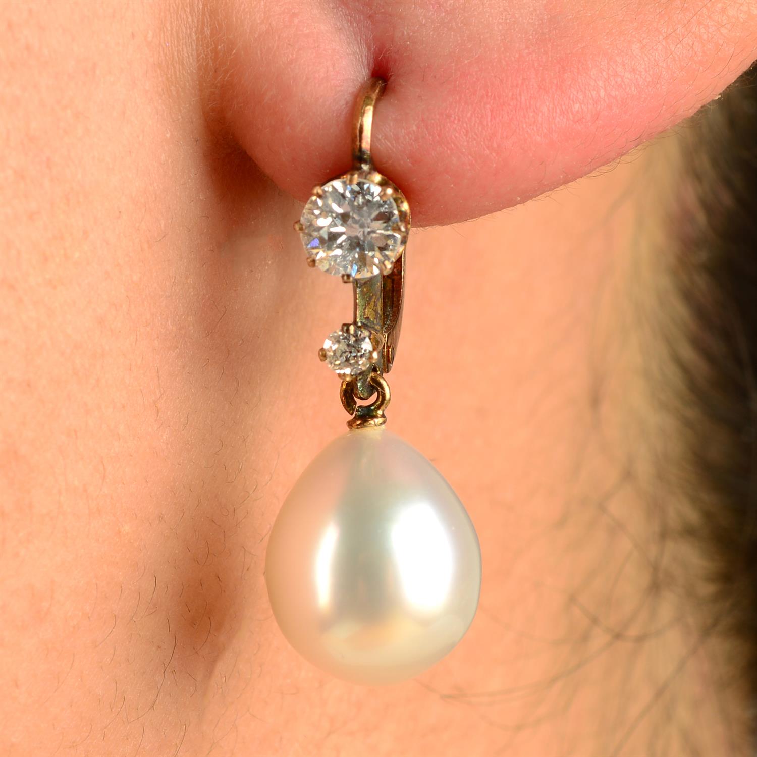 A pair of cultured pearl and old-cut diamond drop earrings.