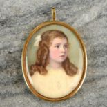 An Edwardian 14ct gold portrait miniature pendant, with glazed locket reverse.