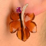 A pair of carved foliate agate earrings, with diamond stem and ruby bud.