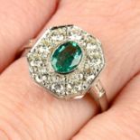 An emerald and brilliant-cut diamond cluster ring.