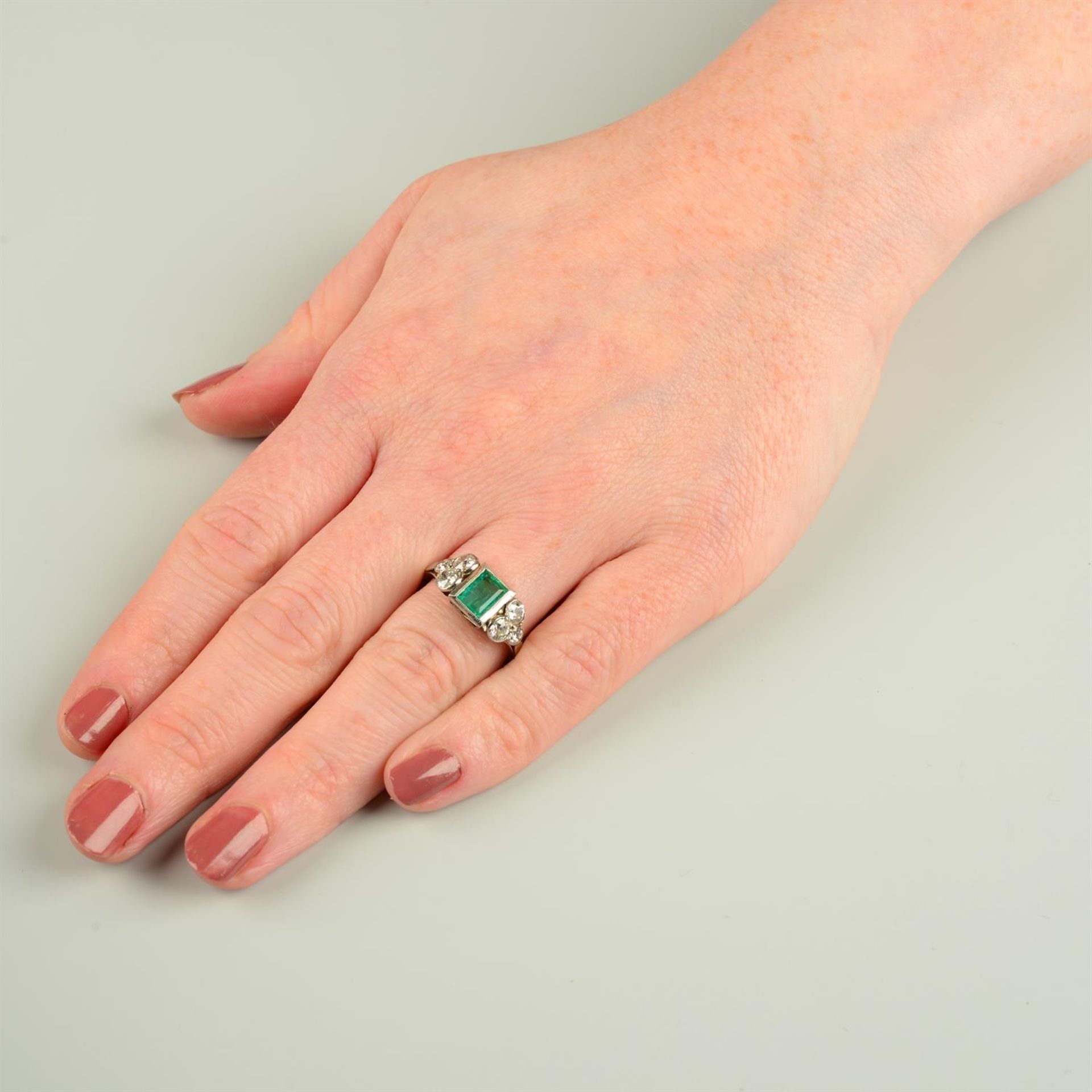 An emerald dress ring, with graduated old-cut diamond trefoil sides. - Image 5 of 5