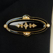 A late 19th century gold onyx and vari-cut diamond mourning brooch, with black enamel and split