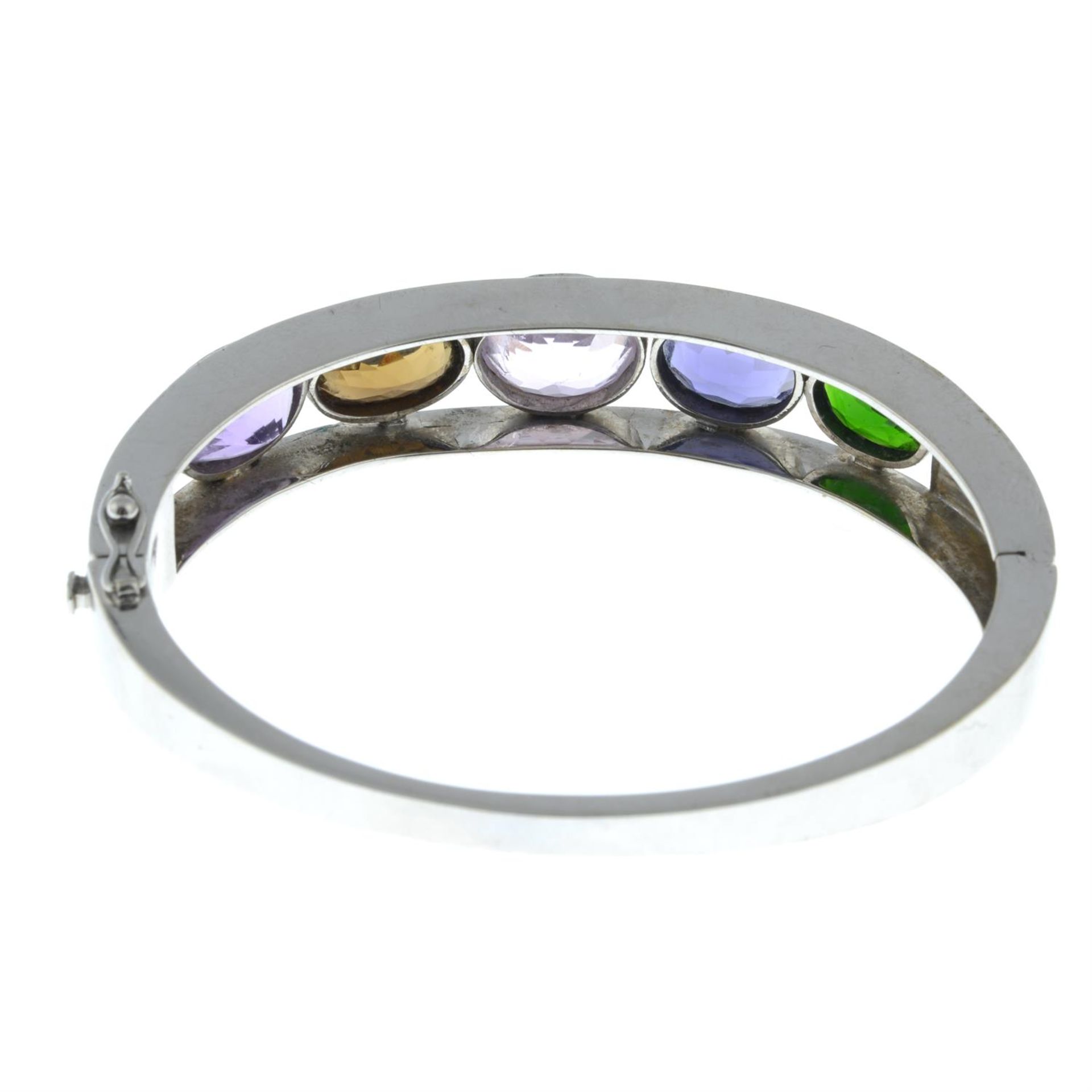 A hinged bangle, with amethyst, morganite, iolite and further collet-set gems. - Image 3 of 3