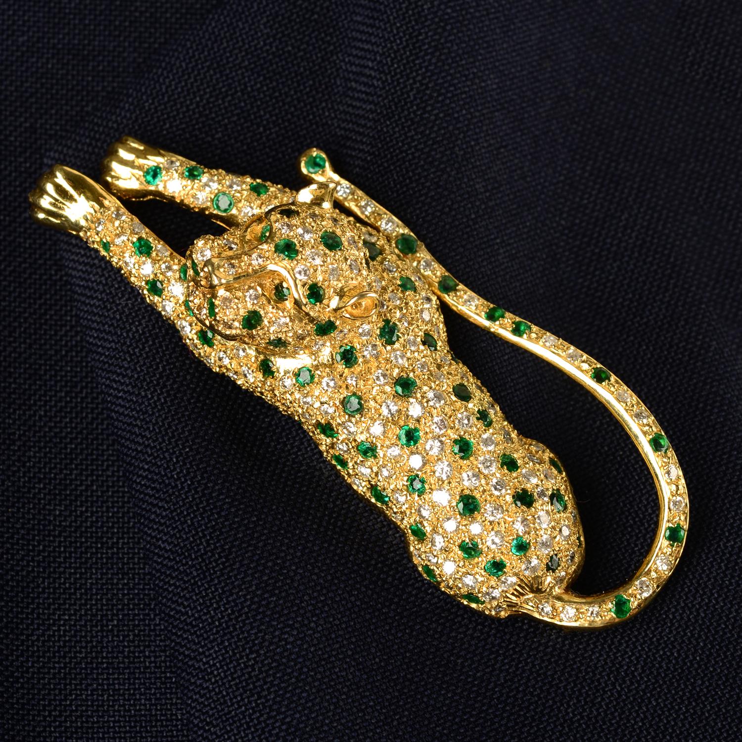 An emerald and brilliant-cut diamond pavé-set leopard brooch.