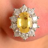 A pair of yellow sapphire and brilliant-cut diamond cluster earrings.