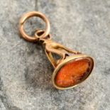An early 19th century gold carnelian intaglio fob, carved to depict a bearded gentleman,