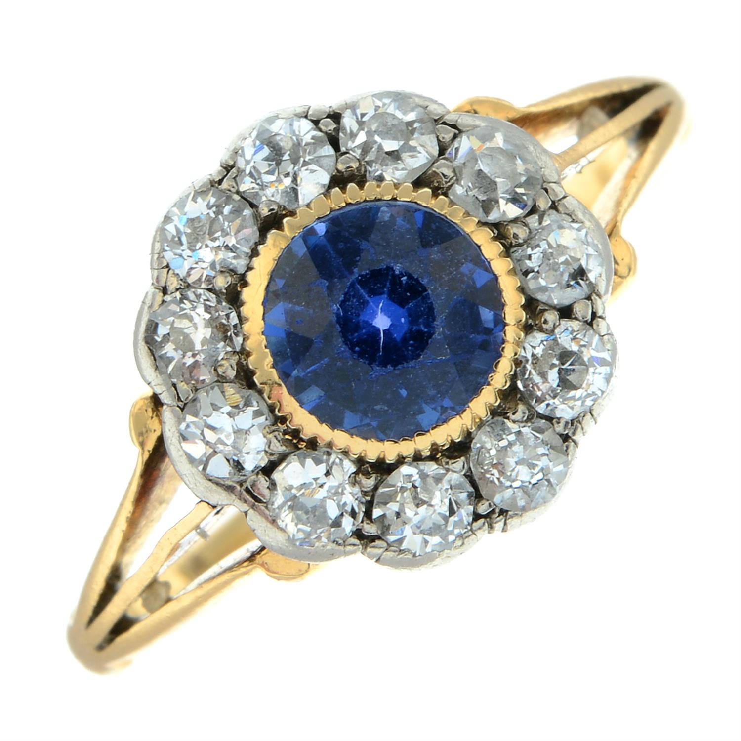 An early 20th century gold sapphire and old-cut diamond cluster ring, with openwork shoulders. - Image 2 of 5