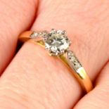 A brilliant-cut diamond single-stone ring, with brilliant-cut diamond shoulders.