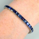 A graduated calibre-cut sapphire line bracelet.