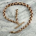 A late 19th century 9ct gold faceted, graduated belcher-link Albert chain, with later T-bar and