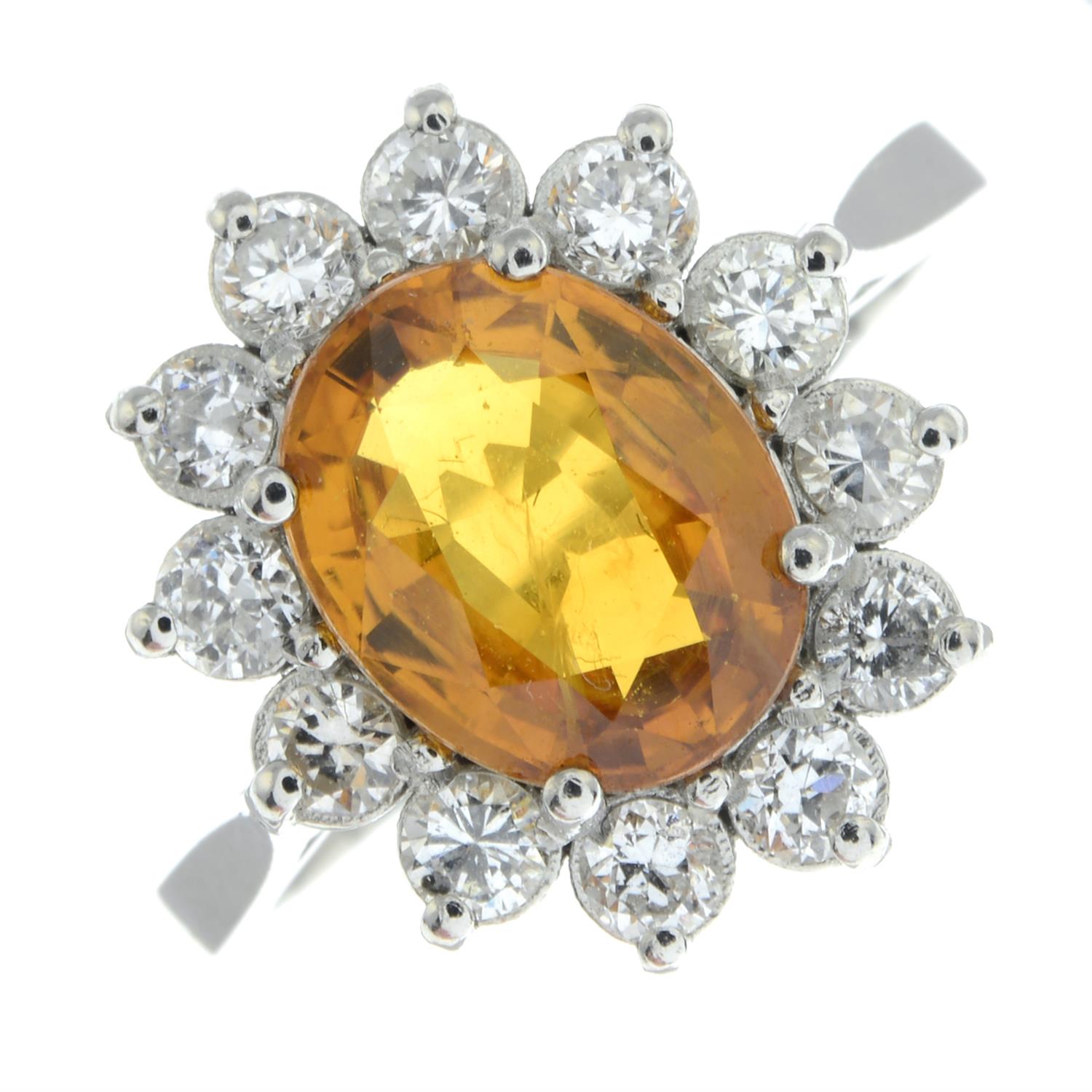 An orange sapphire and brilliant-cut diamond cluster ring. - Image 2 of 5