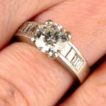 A platinum brilliant-cut diamond ring, with baguette-cut diamond shoulders.